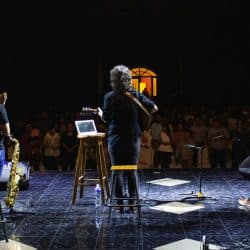 band on stage giving a presentation.