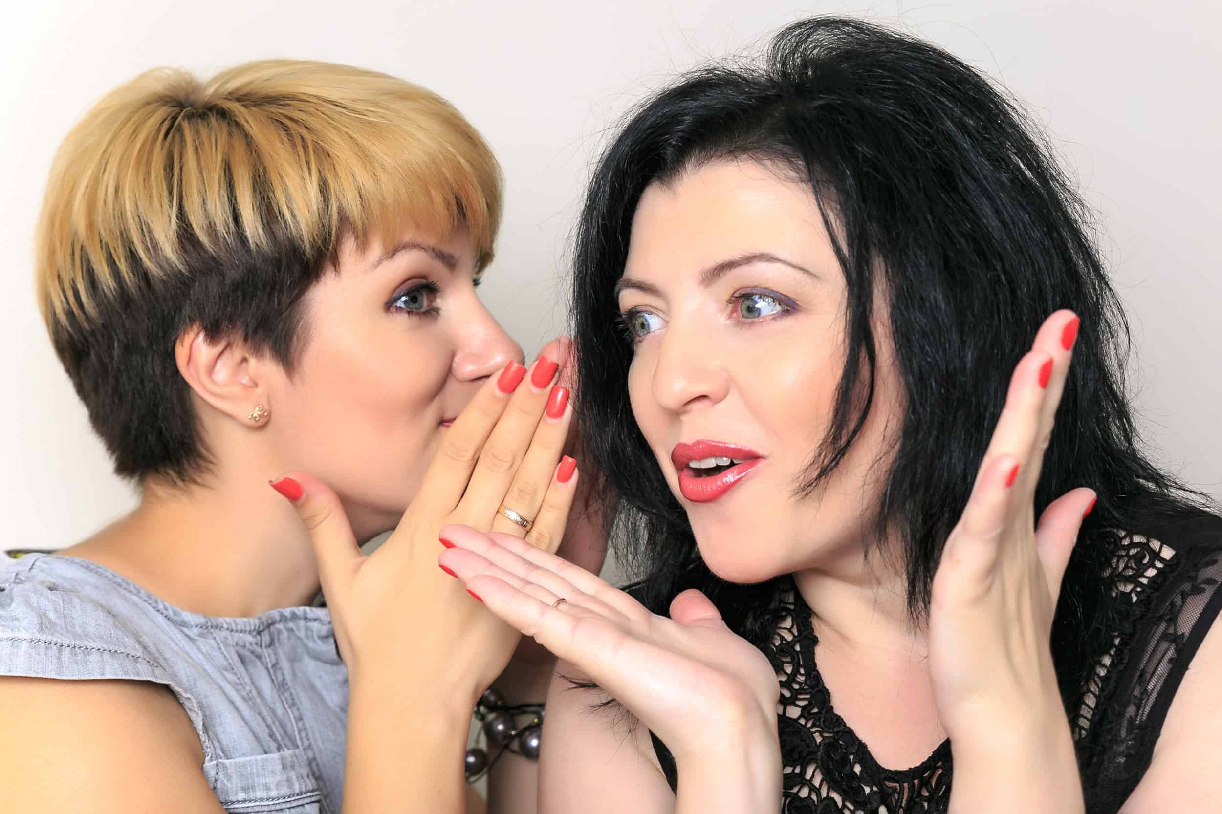 Women whispering about the secrets to finding true love.