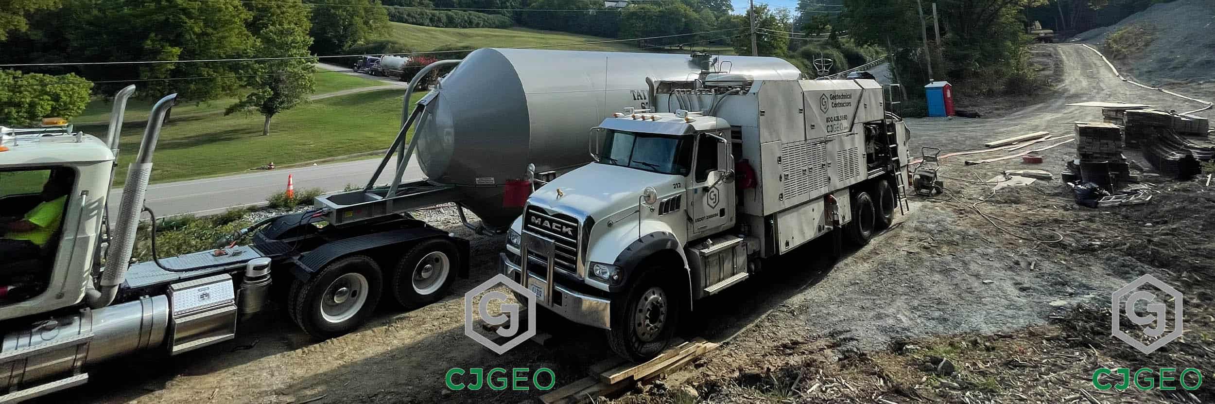 A CJGeo mobile batch plant and bulk tanker truck used for cellular concrete production on a project site.