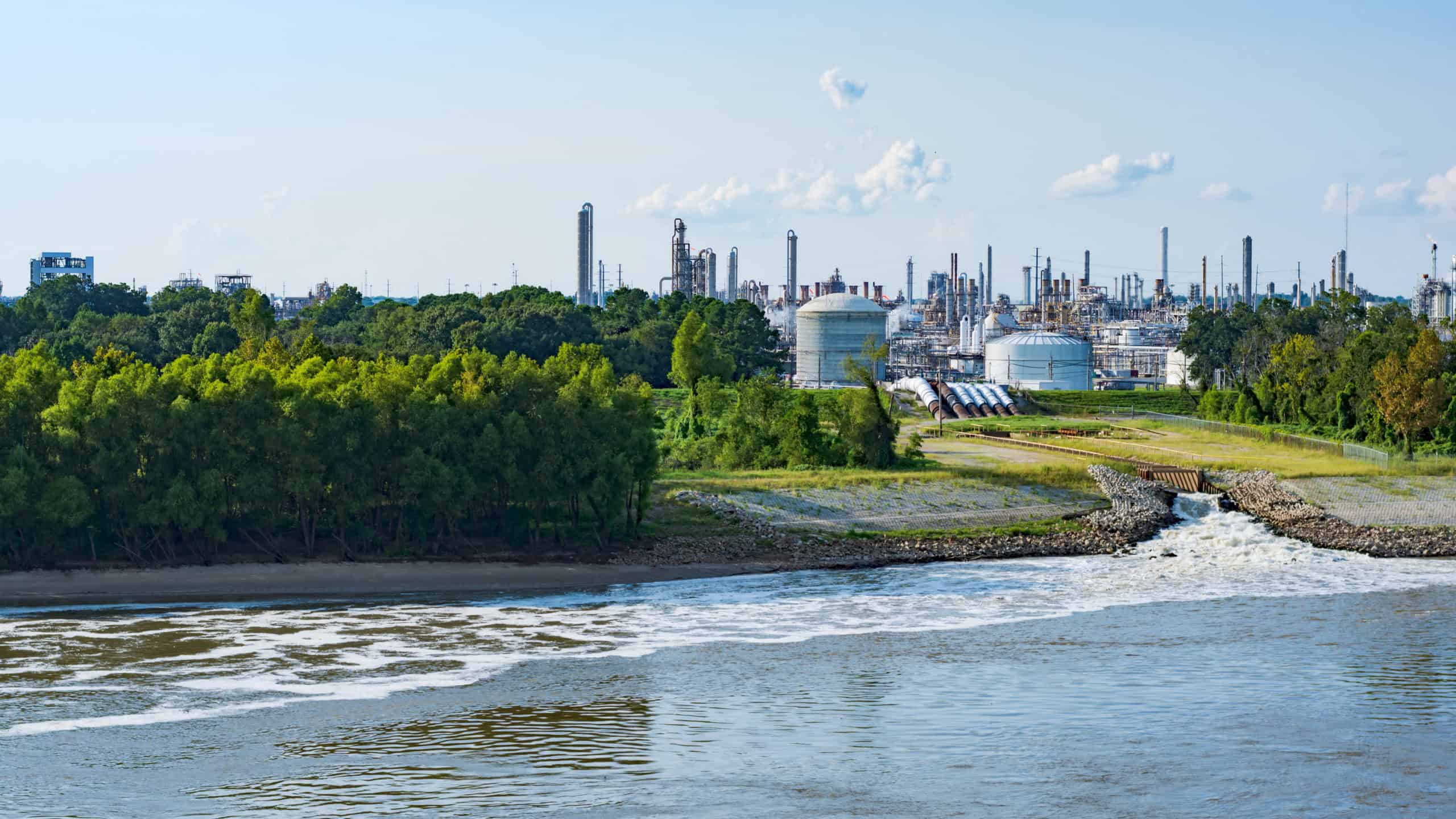 Industrial chemical plant on a riverbank, representing the century-old Monsanto/Solutia facility in St. Louis featured in this case study.