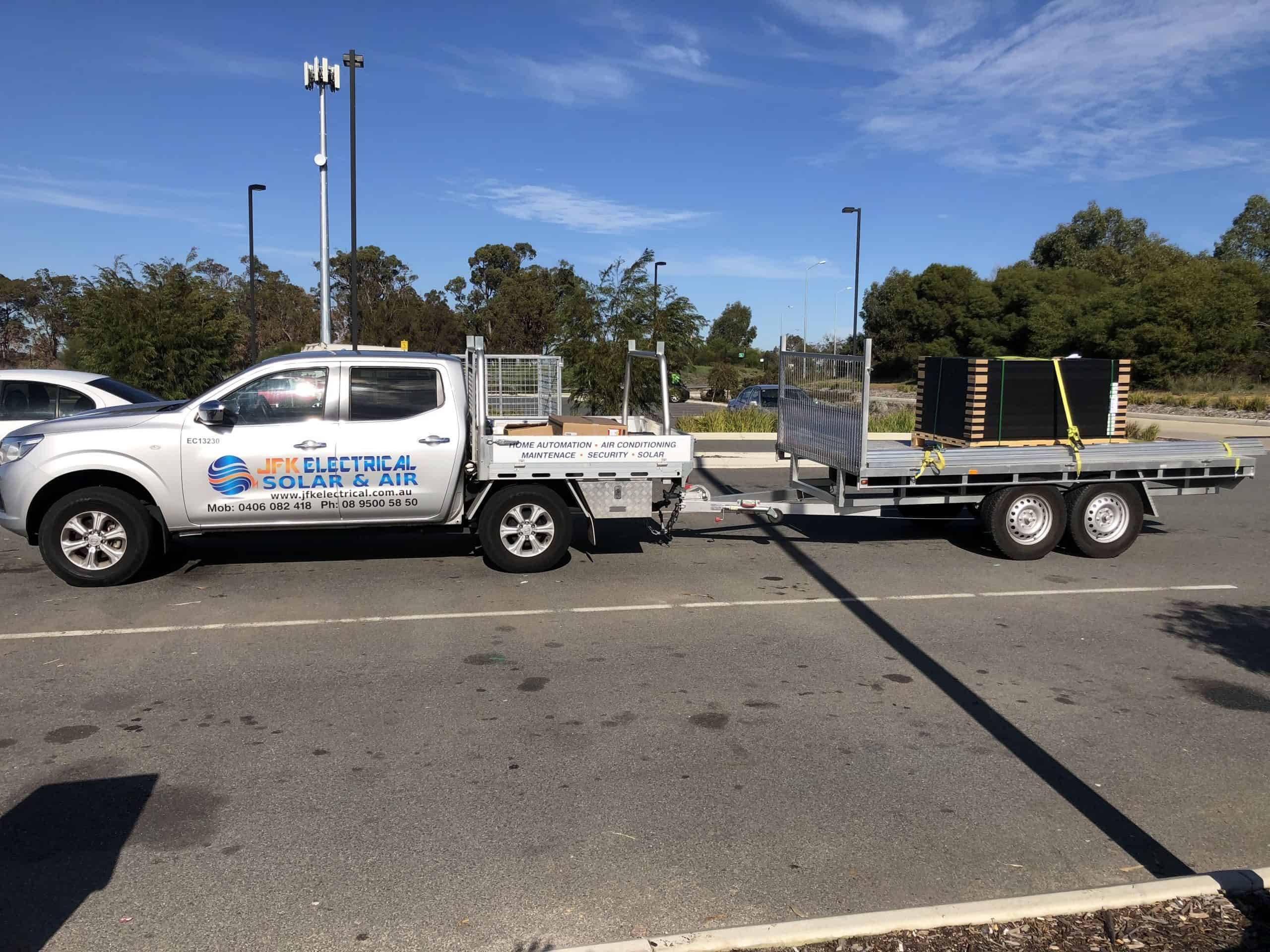 JFK Electrical Solar & Air truck hauling solar panel equipment