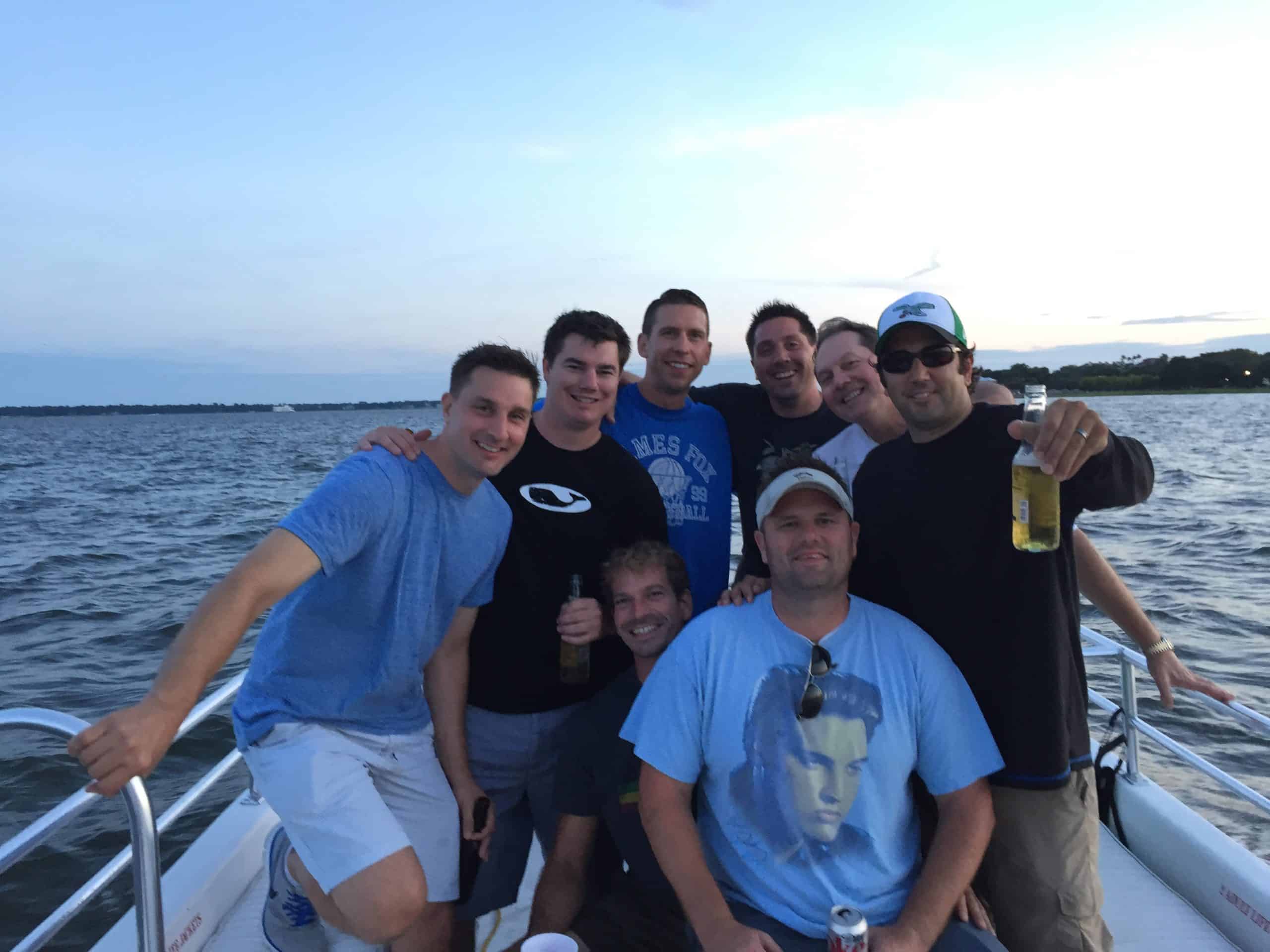 Group of men gathered on the boat. Bachelor and bachelorette boat cruises
