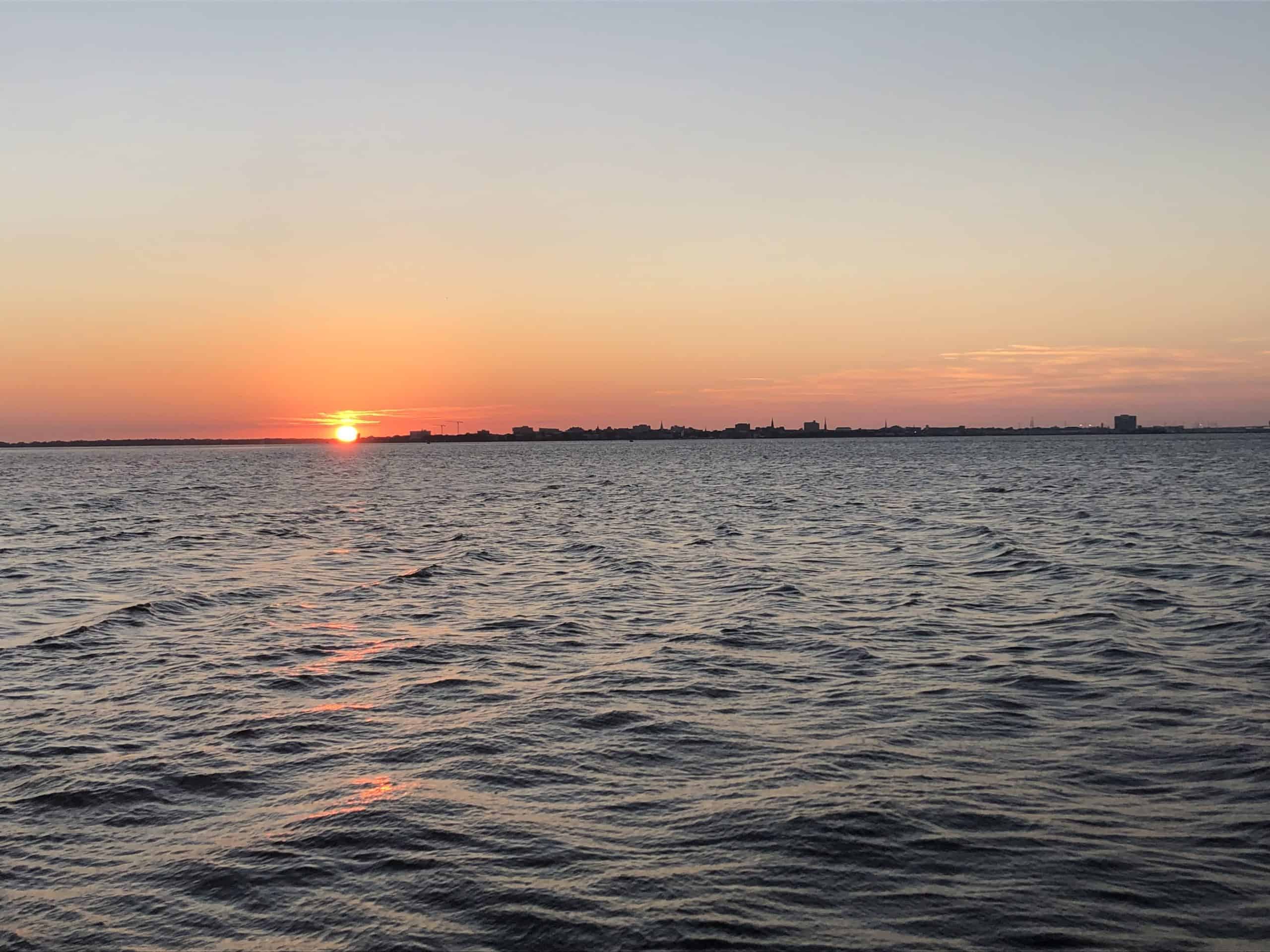 Sun setting on water. Sunset cocktail cruise Charleston, SC