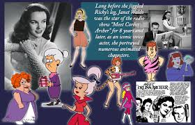 Janet Waldo receiving a lifetime achievement award, smiling beside animation cels of her characters.