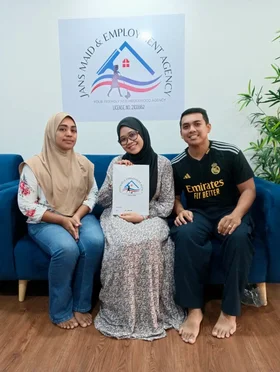 maid agency Singapore clients with helper in living room