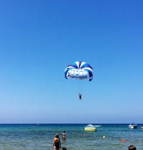 2 people doing paragliding at golden sand bay