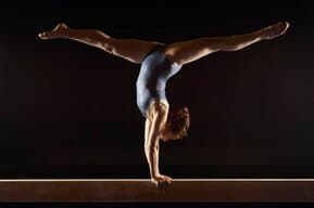 a woman who practises gymnastics