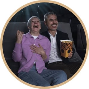 "5 Signs You Are Ready For True Love" image of a happy, loving couple laughing in a. movie theater
