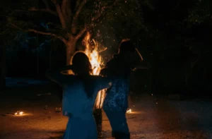 Couple dancing by a bonfire during a Palawan boat trip