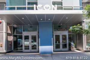 Modern urban residential entrance at 321 10th Ave with a sleek grey overhang, large glass doors, and bold "ICON" signage.