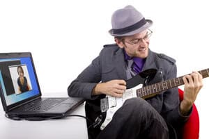 Man serenading his virtual date in his quest to find love online.