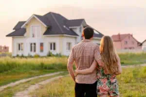 Couple Looking at Their New House | Real Estate Lawyers One80Law Group