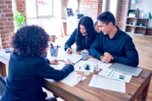 Young Couple Applying for Mortgage | Real Estate Law Services Calgary | Calgary Real Estate Lawyer | One80Law Group