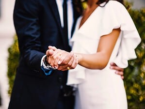 A newly married couple having their first dance.