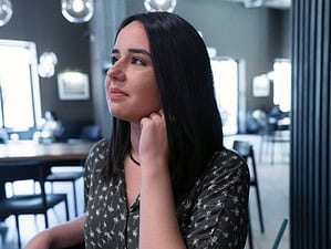 Woman sitting by herself wondering, 'Will I ever meet someone?'