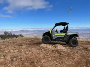Vortex ATV rental posing on rock in Mingus Mountain