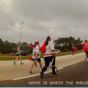 Runners on World Drive heading back to Epcot