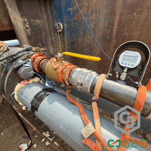 A pressure gauge reading 1.19 psi during placement of thermal grout with multiple conduits.