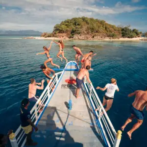 Group jumping into the boat during the El Nido to Coron Expedition