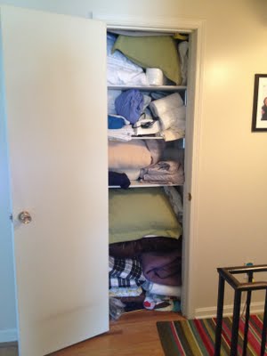 Before picture of organized hall closet