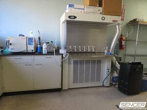 Clinical laboratory with a biosafety cabinet, a Tuttnauer benchtop autoclave, and lab casework, equipment valued in a laboratory equipment appraisal.