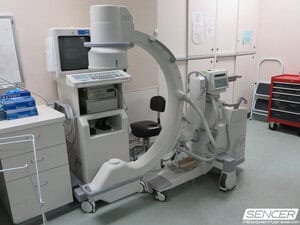 GE OEC mobile C-arm fluoroscopy system with its imaging monitor cart, diagnostic imaging equipment valued in a medical equipment appraisal.