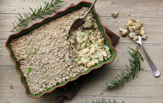 Vegan butter bean bake with creamed coconut, nutmeg and rosemary