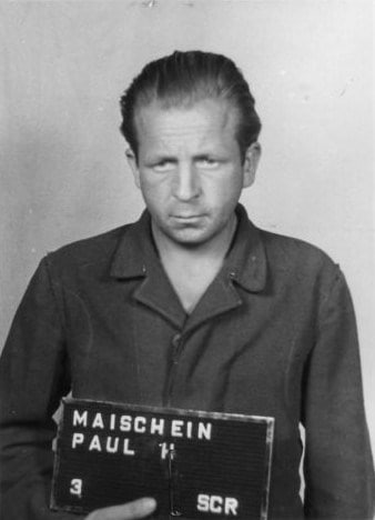 Afbeelding Paul H. Maischein tijdens het Dachauer Dora-proces Haftbogenfoto van Paul H. Maischein, SS-Rottenführer en verpleger in Mittelbau-Dora, veroordeeld tot vijf jaar cel.