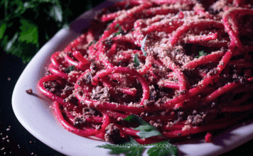 A spooky pasta dish resembling worms made with bucatini, tapenade, and breadcrumbs.