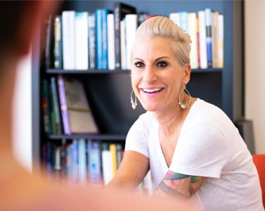 Happy therapist smiling at teen client