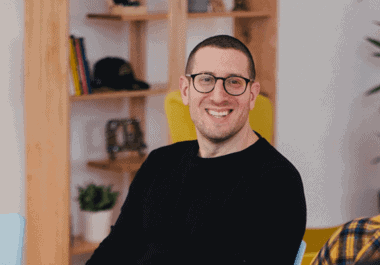 Focused professional male in modern office environment, emphasizing outcome-driven approaches and innovative solutions.