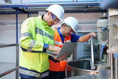 Technician implementing eWorkOrders CMMS