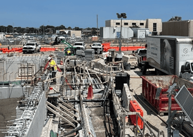 CJGeo cellular concrete batching equipment on a congested construction site.