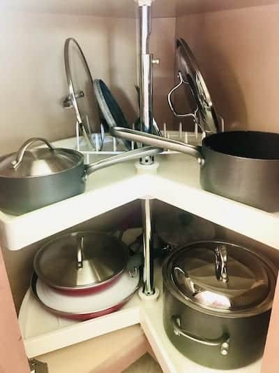 pots and pans in a Lazy Susan corner cabinet