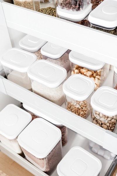 organized oxo pop containers in kitchen pantry