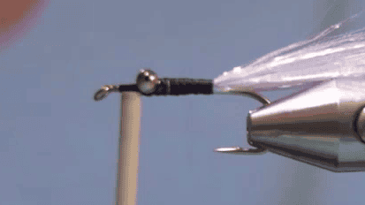 Crystal Flash tied in at the rear of the hook and thread returned to the eyes, ready to form the body.