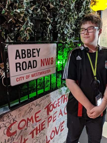 Ben with the Abbey Road sign at the Beatles Story