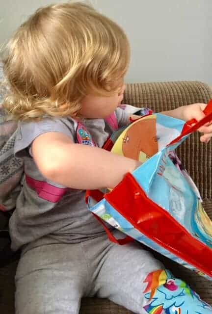 Baby girl with her book bag
