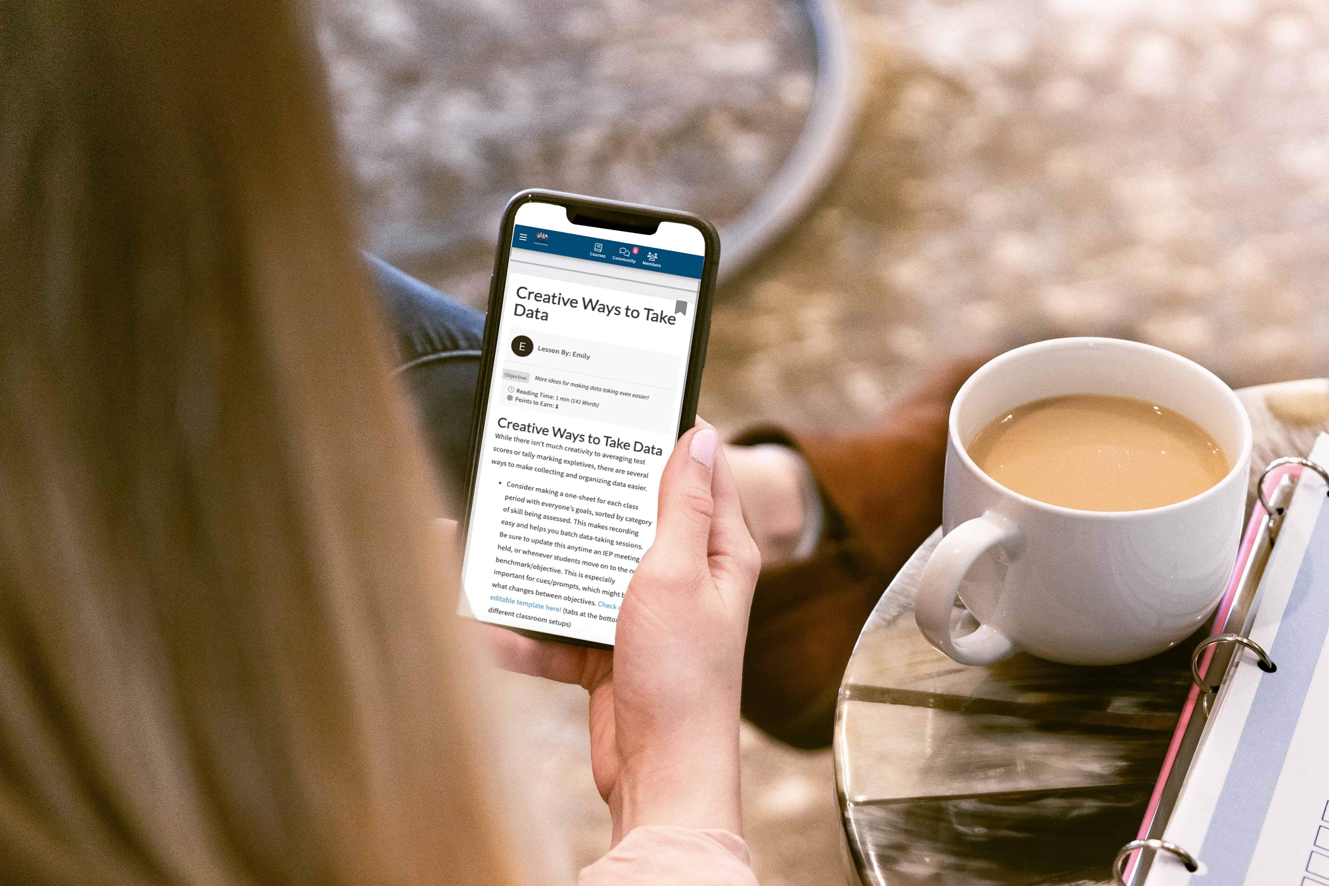 A woman is using her phone to read an article about iep data.
