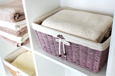 organize with baskets: linen closet