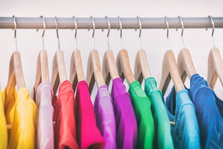 Organizing a bedroom armoire: arrange clothes by color