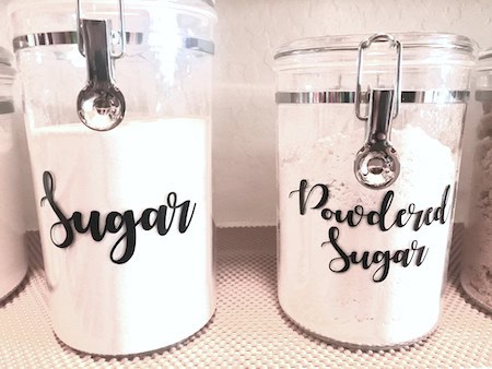 Organize a walk-in pantry: labeled canisters