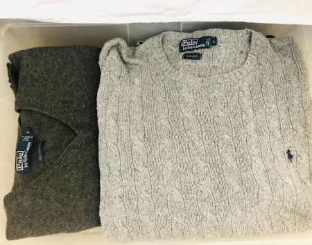 Organize clothes without a dresser: bulky sweaters can be stored in under bed storage bins.