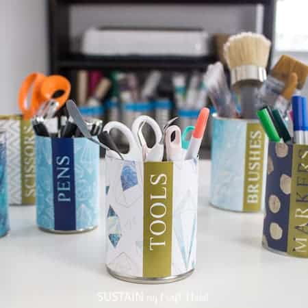 Colored pencil storage ideas: try an upcycled tin can project with labels printed from a Cricut.