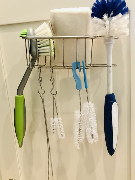 Organize under the kitchen sink: adhesive sponge and brush holder