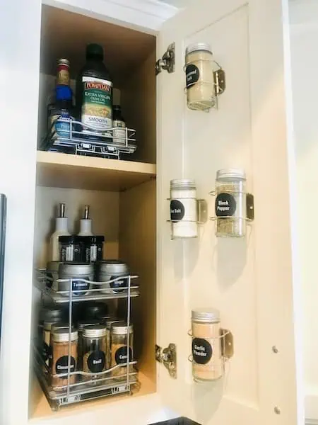 Spice Storage for a Small Kitchen: declutter kitchen Counters by storing everyday spices on the inside of a cabinet.