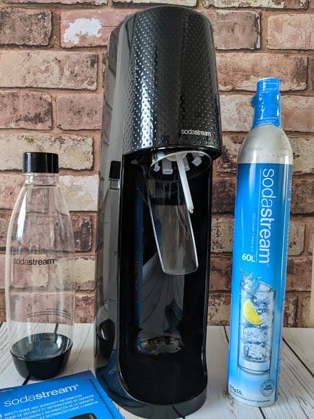 Sodastream Spirit and pieces in front of brick wall