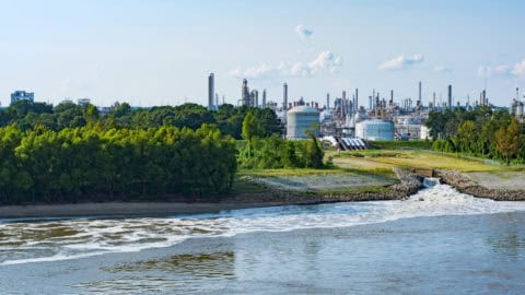 Industrial chemical plant on a riverbank, representing the century-old Monsanto/Solutia facility in St. Louis featured in this case study.