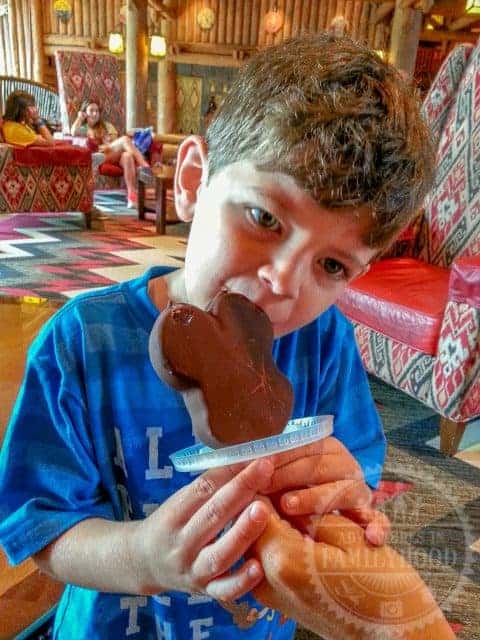 Jackson enjoys mickey bar at Disney World with Soda Lid Life Hack