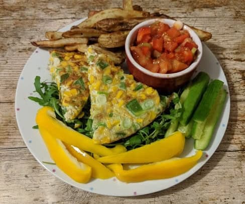 sweetcorn quiche or fritter with salad, salsa and chips